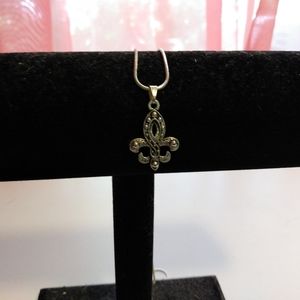 Silver and black fleur di lis necklace